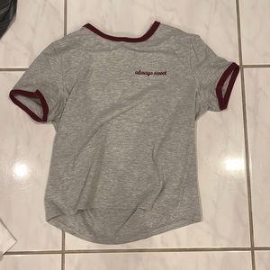 Grey shirt that says “always sweet” on the top left